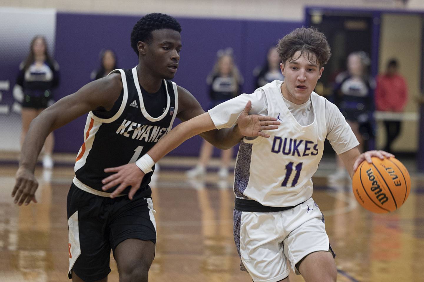 Dixon’s Brody Nicklaus handles the ball against Kewanee’s Dayvon Robinson Tuesday, Dec. 2, 2025.