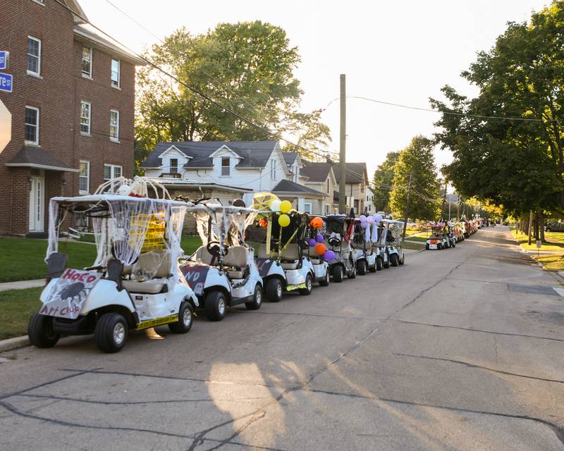 Decorated golf carts wait for students to use during the Sycamore High School Homecoming parade on Wednesday, Oct. 8, 2025, downtown.