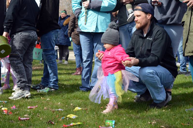 Sophie Fager, 1, of Forreston, holds dad Jake Fager's hands while waiting for the 2-and-under Easter egg hunt. Forreston's annual Easter egg hunt took place in Memorial Park on April 16.