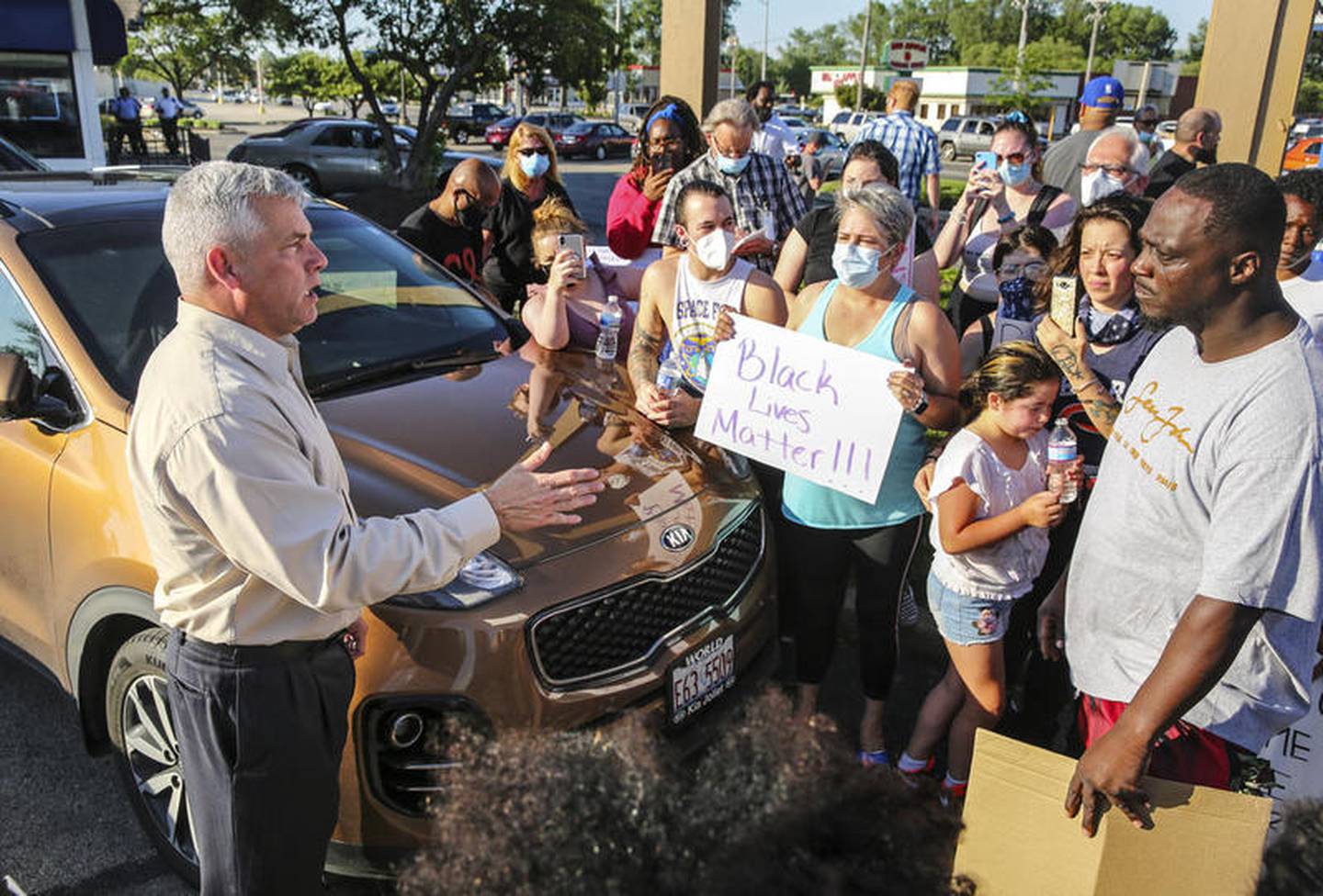 Peaceful protestors speak with Mayor Bob O'Dekirk and members of the city council Tuesday, June 2, 2020 after O'Dekirk grabbed a man and threw him to the ground during the demonstration early Monday morning.