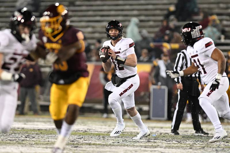 NIU quarterback Rocky Lombardi looks to pass against Central Michigan on Tuesday, October 31, 2023