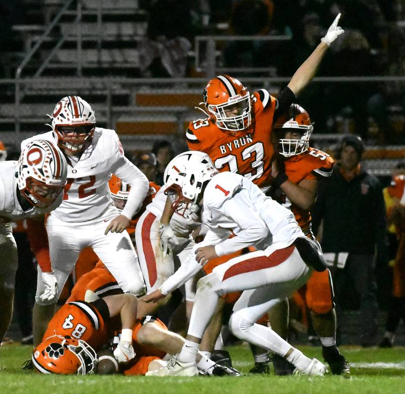 Byron's Zion Gautier (84) recovers an Oregon fumble as his teammate Ben Hiveley (33) reacts to the play on Friday, Oct. 31, 2025 in the first round of the 3A state playoffs held at the Everett Stine Stadium in Byron. The Tigers won the game 63-15.