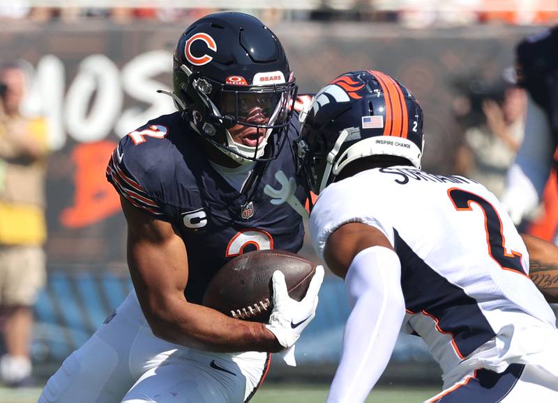 Chicago Bears wide receiver DJ Moore looks to get by Denver Broncos cornerback Pat Surtain II during their game Sunday, Oct. 1, 2023, at Soldier Field in Chicago.