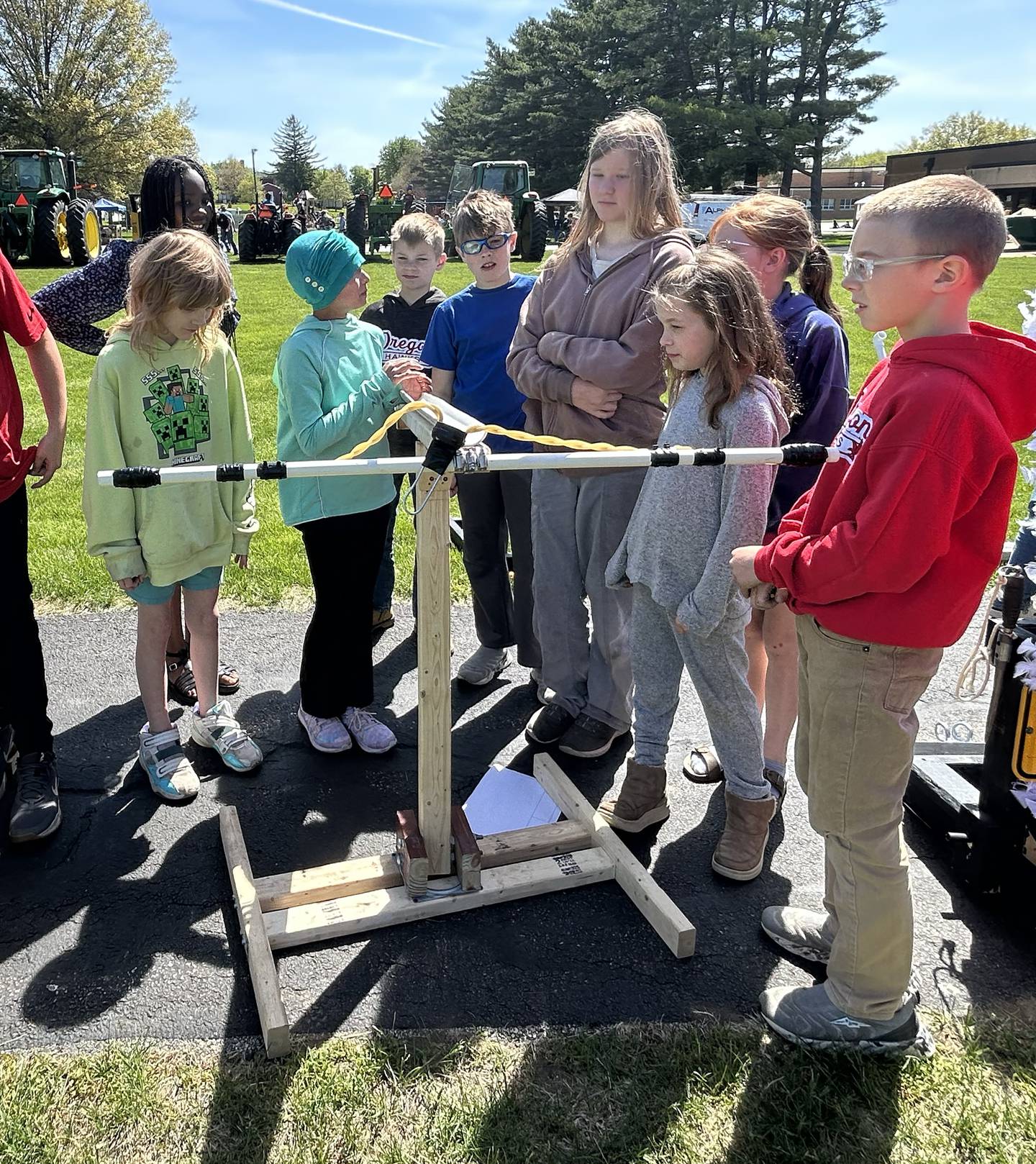 Oregon sixth grader Kaileena Pham explains how her ballistic catapult works to fellow students on Friday, May 9, 2025.