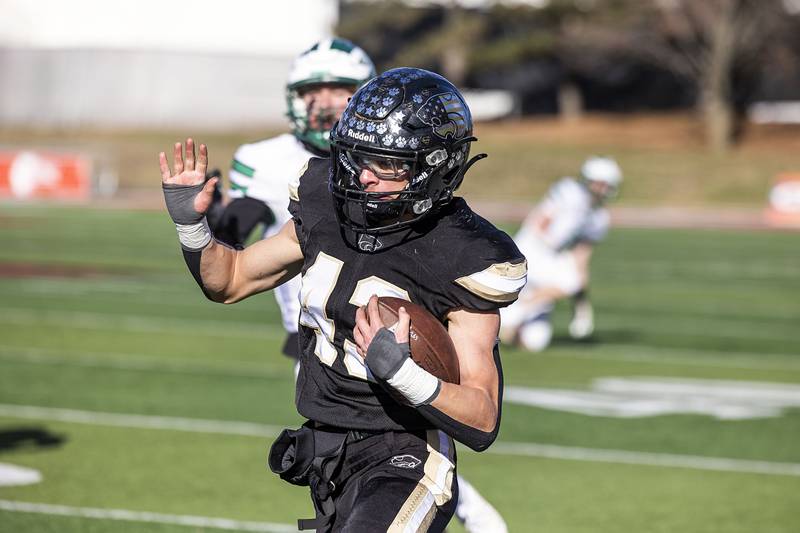 Lena-Winslow’s Alec Schlichting gets by the Brown County defense Friday, Nov. 28, 2025, in the Class 1A football finals at Hancock Stadium at ISU.