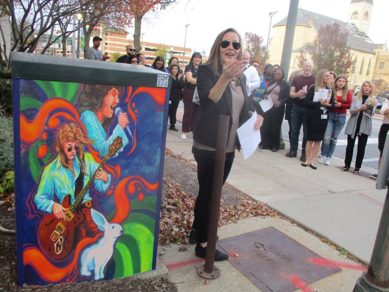 Priscilla Cordero, executive director of the Joliet City Center Partnership, talks about the Downtown Music Box Project before a ribbon-cutting ceremony on Wednesday for the 10 utility boxes downtown not covered with artwork depicting musical images. Oct. 30, 2024