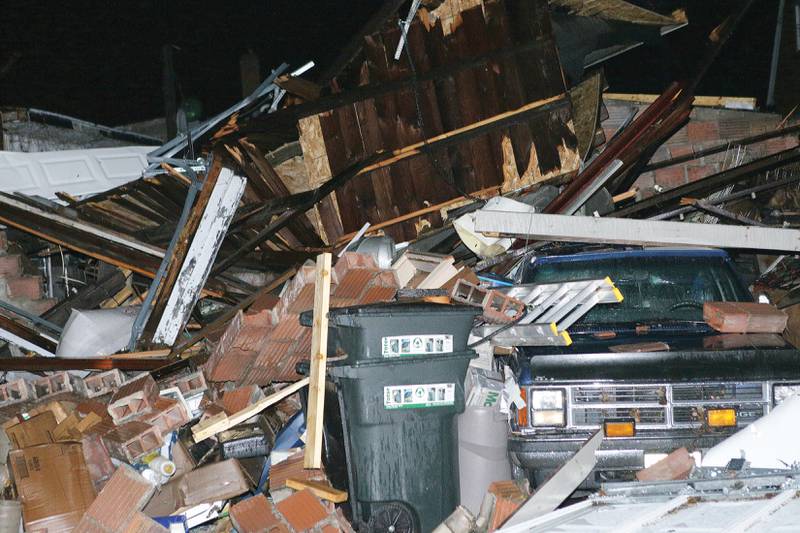 A truck sits under debris after a structure collapsed on top of it during the tornado that struck Naplate on Tuesday, Feb 28, 2017 in Naplate.