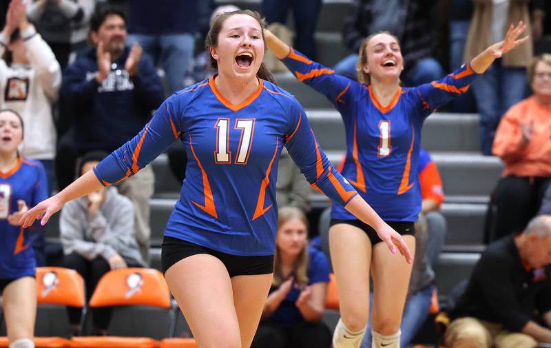 Genoa-Kingston players celebrate the final point of their win in the Class 2A sectional semifinal match against Rockford Christian Monday, Oct. 31, 2022, at Winnebago High School.