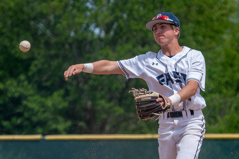 Oswego East's Andrew Lewis (10) fields a grounder and throws to first for an out against Waubonsie Valley during the Class 4A Waubonsie Valley Regional final between Waubonsie Valley and Oswego Easy at Waubonsie Valley High School in Aurora on Saturday, May 27, 2023.
