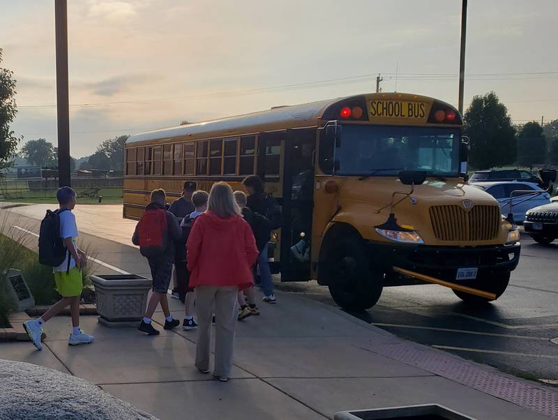 Students left one bus and entered another at the Putnam County Primary Scho for the first day of school.