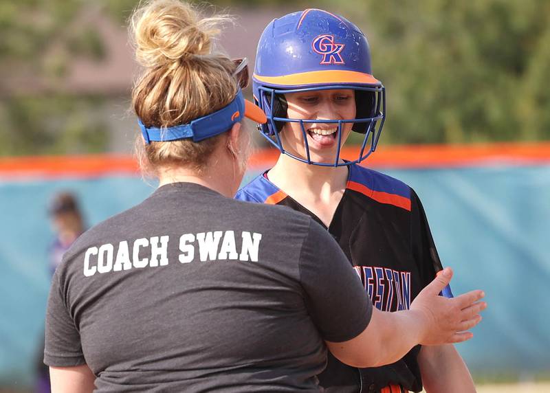 Genoa-Kingston's Violet Northrup is congratulated by head coach Erica Swan after hitting a triple during their Class 2A Regional quarter final game against Rockford Lutheran Monday, May 15, 2023, at Genoa-Kingston High School.