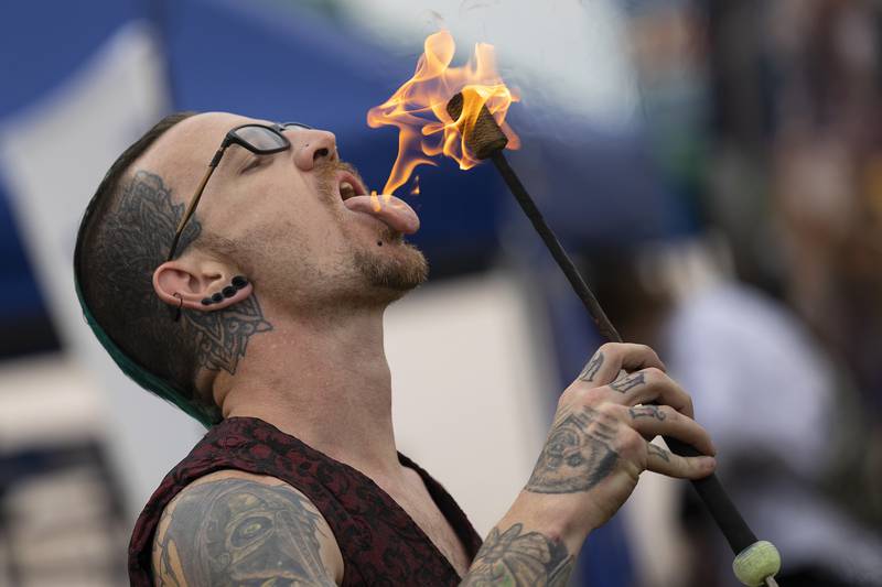 Michael Baker eats fire at Fall and Fantasy Fest Saturday, Sept. 20, 2025, in Dixon. The festival brought in unique vendors, blacksmithing, cannon fire demonstrations and more in a fun and fantastical two day event.