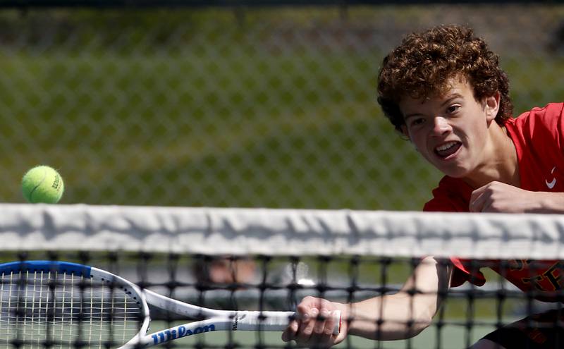 Batavia's Erik Warner returns the ball during an IHSA 2A boys doubles tennis match Thursday, May 25, 2023, at Buffalo Grove High School.