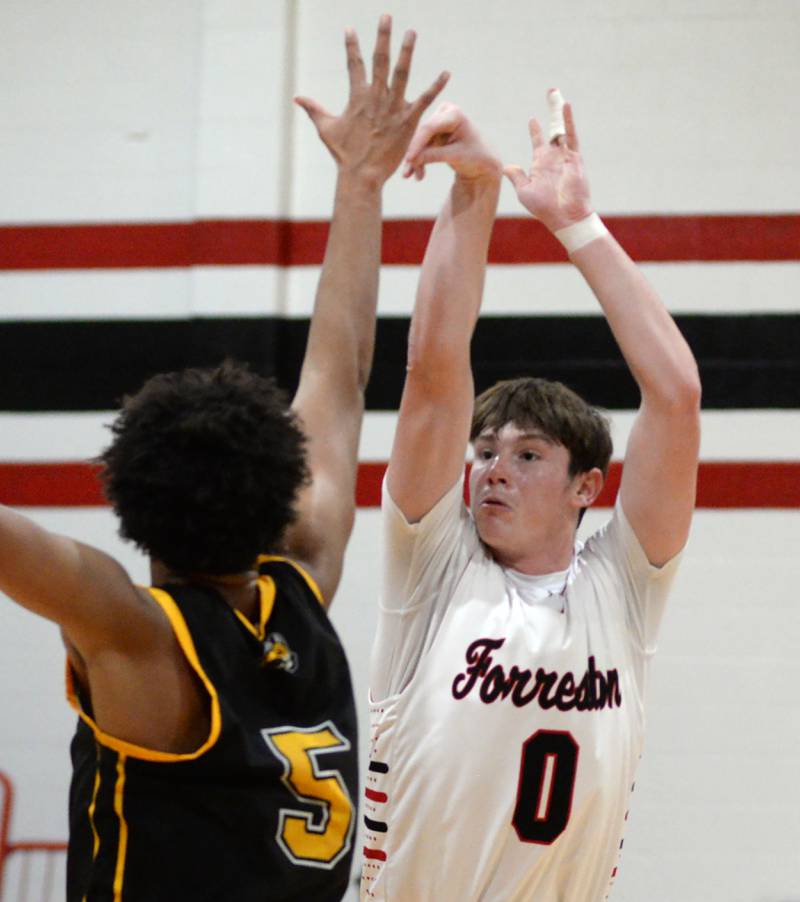 Forreston's Brandon Greenfield (0) shoots against Riverdale on Friday, Dec. 27, 2024 at the Cliff Warkins Memorial Basketball Tournament at Erie High School.