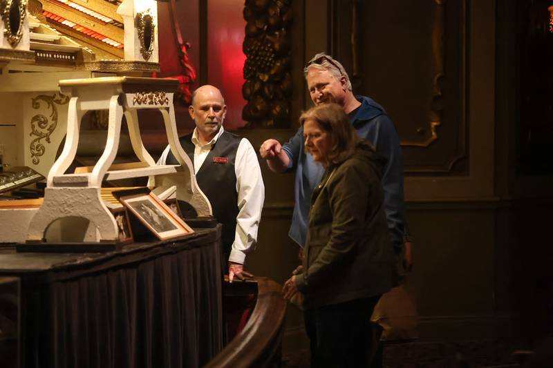Pipe organ player Taylor Trimby talks with a couple at the Rialto Theater’s 100th anniversary celebration on Sunday, May 3, 2026 in Joliet.