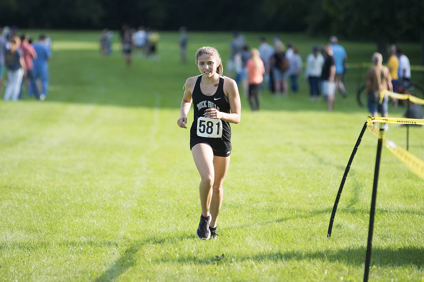 Rock Falls' Hanna Ford eyes the finish line for second place at the Twin Cities cross country meet in Sterling, Sept. 13, 2022.