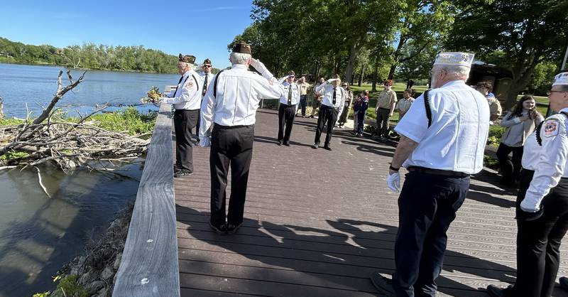 Vietnam War Veteran Jerry Frana prepares to throw a wreath into the Rock River from the overlook at Oregon Park East in honor of veterans who served at sea. The wreath dedication was part of  the Oregon VFW's Memorial Day services on Monday, May 26, 2025.