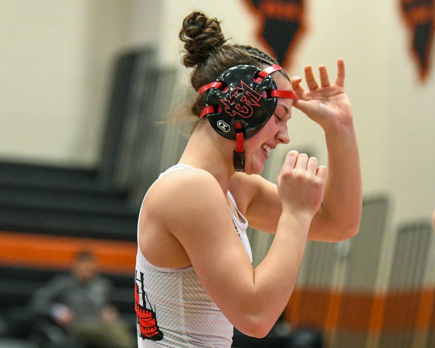 Fulton’s wrestler Kerby Germann is all smiles after getting the win during the regional championship match up in the 130-pound weight class on Saturday Feb. 14, 2026, held at DeKalb High School.