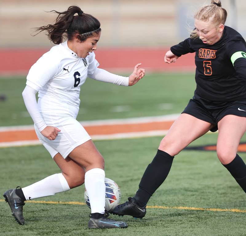 DeKalb’s Ashley Diedrich tries to get by Belvidere North’s Keyla Suarez during their game Wednesday, March 15, 2023, at DeKalb High School.