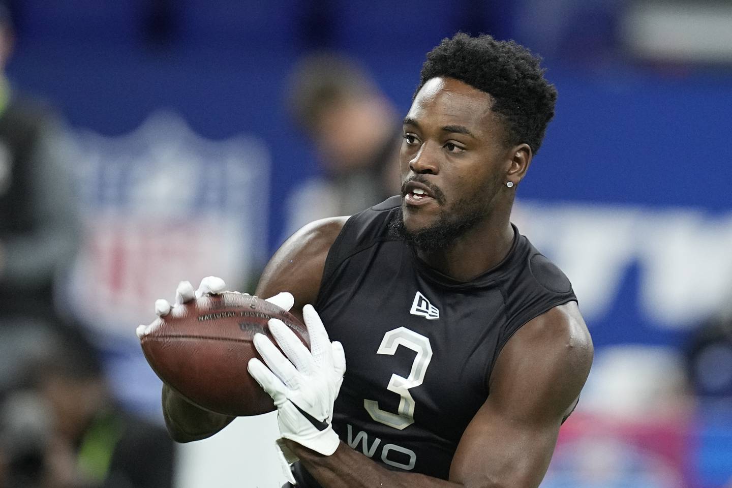 Purdue wide receiver David Bell runs a drill during the NFL scouting combine, Thursday, March 3, 2022, in Indianapolis.
