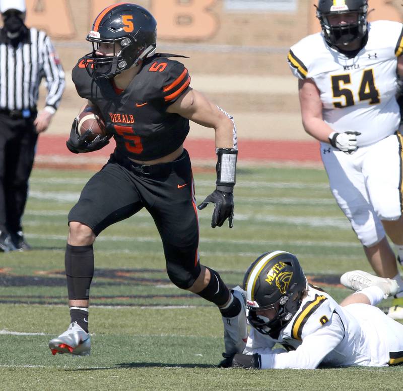 DeKalb junior Toriano Tate escapes a Metea Valley defender during their game Saturday afternoon at DeKalb High School.