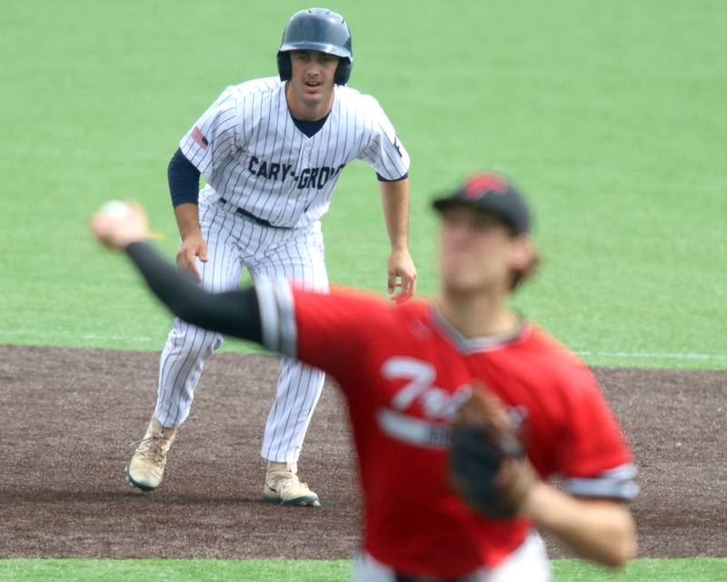 Cary-Grove’s Francis Panko gets a lead off second base as Triad’s Drew Winslow delivers in IHSA Class 3A Third Place Game baseball action at Slammer Stadium in Joliet on Saturday, June 14, 2025.