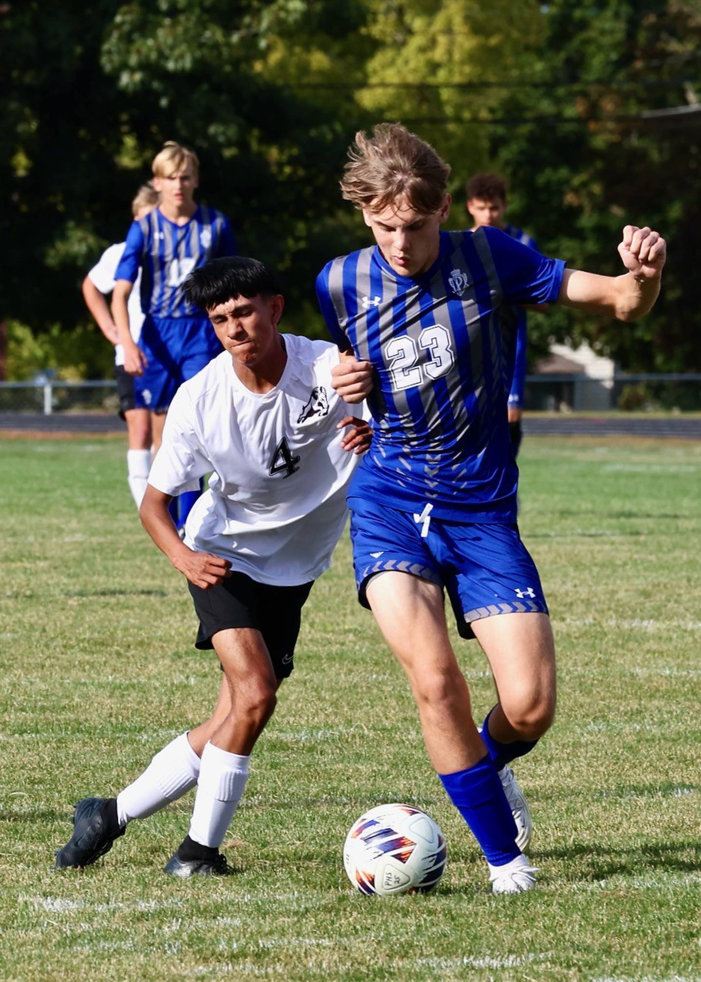 Princeton's Jakoby Smallwood battles for the ball against Riverdale in Tuesday's Three Rivers soccer match at Bryant Field. He scored a goal in the Tigers' 3-1 win.