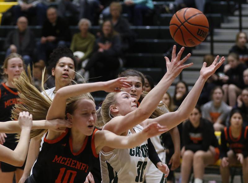 McHenry's Bethany Snyder  battles with Crystal Lake South's Hanna Massie for a rebound during a Fox Valley Conference girls basketball game Tuesday Jan. 10, 2023, at Crystal Lake South High School.