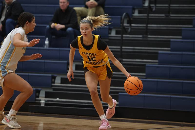 Carmel’s Josie Hartman drives to the baseline against Joliet Catholic on Wednesday, Jan 15, 2025 in Joliet.