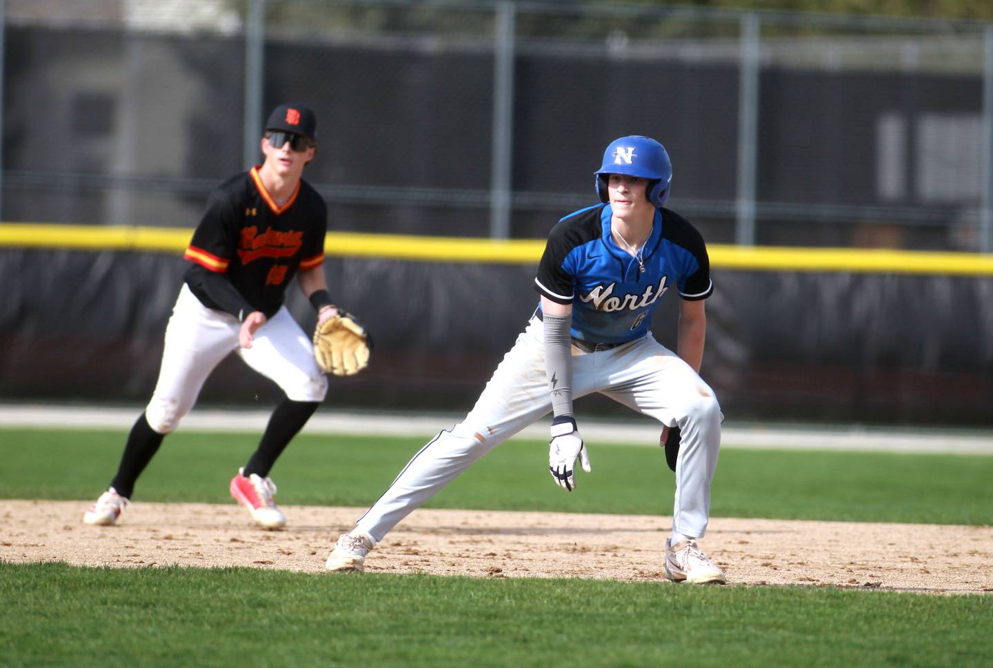 St. Charles North's Keaton Reinke leads off from second base during a game against Batavia on Thursday, April 24, 2025 in Batavia.