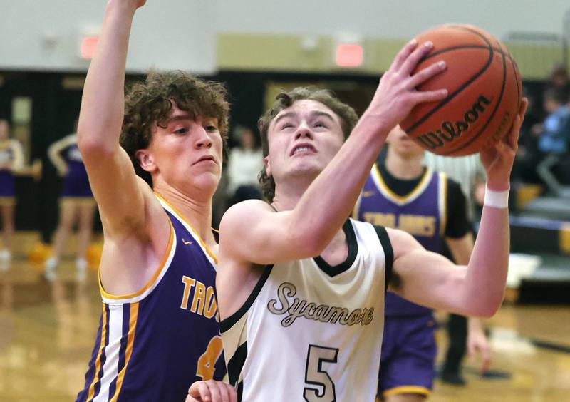 Sycamore's Preston Picolotti goes to the basket against Mendota's Jace Baird during their game Wednesday, Dec. 13, 2023, at Sycamore High School.