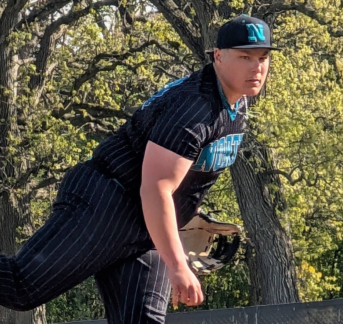 Woodstock North's Levi Perrotta delivers a pitch against Woodstock in Kishwaukee River Conference baseball action Thursday, May 7, 2026, at Emricson Park in Woodstock.