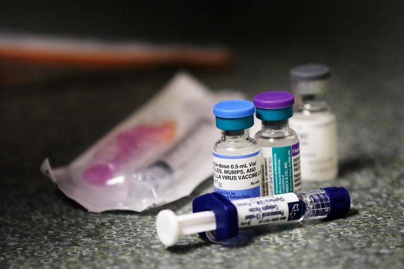 Vaccinations for the viral diseases Hepatitis A, Measles, Mumps, and Rubella sit on a counter as medical assistant Teresa Velazquez fills syringes with the liquids for Hayley Wilson of Wonder Lake, 1, at Northwestern Medicine - McHenry Campus on Thursday, Nov. 29, 2018 in McHenry.