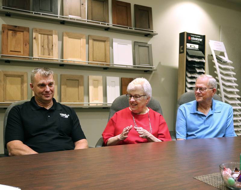 Greg Spears, (left) Ken Spears Construction president, talks with his parents and company founders, Ken and Kathy Spears Friday, Aug 22, 2025, at the business in DeKalb. The company is celebrating its 50th anniversary this year.