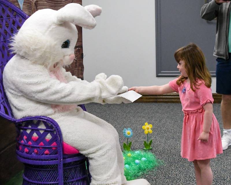 Maddie Lynch, 4, of La Grange hands a note she made for the Easter Bunny on Saturday March 29, 2025, during the breakfast with the bunny event held at the La Grange Park District Recreation Center.