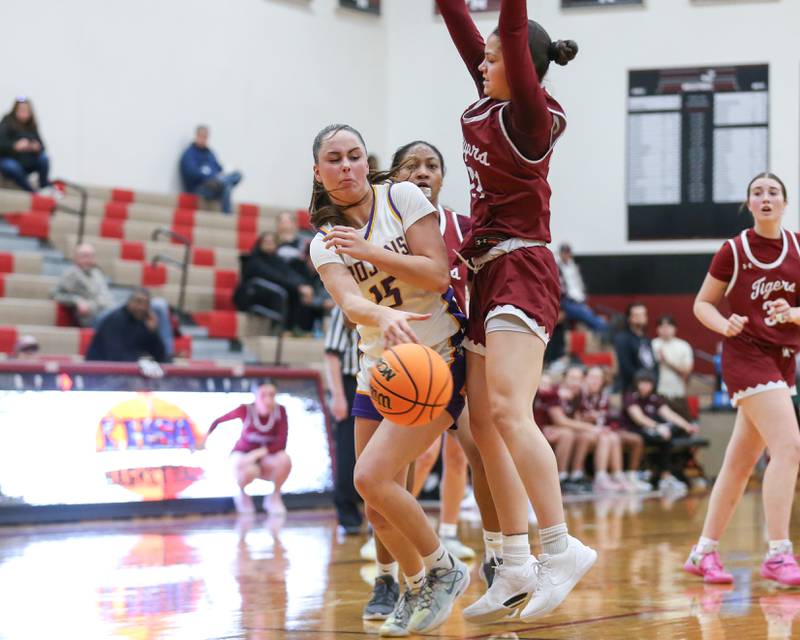 Downers Grove North's Adysen Fanta (15) makes a pass underneath the basket during their Regional Final basketball game between Downers Grove North at Plainfield North. Feb 20, 2025 in Plainfield.