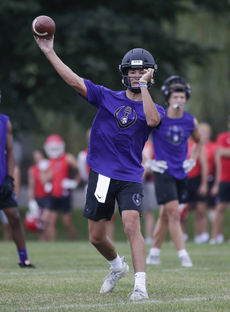 Downers Grove North’s Sam Reichert passes the ball during the Downers Grove South 7-on-7 in Downers Grove on Saturday, July 16, 2022.