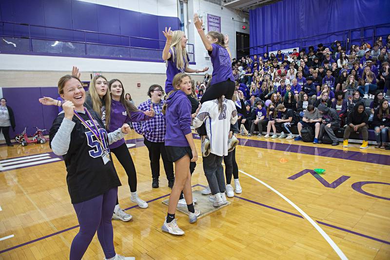 The Dixon High School freshman class react to losing a round Friday, Sept. 30, 2022 in the “pack the plywood” game during the school’s homecoming pep rally.