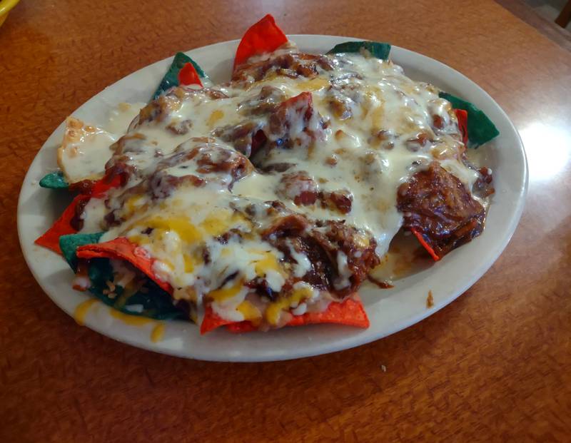 The barbecue nachos appetizer at Mr. Salsas featured carnitas topped with cheese dip, beans and barbecue.