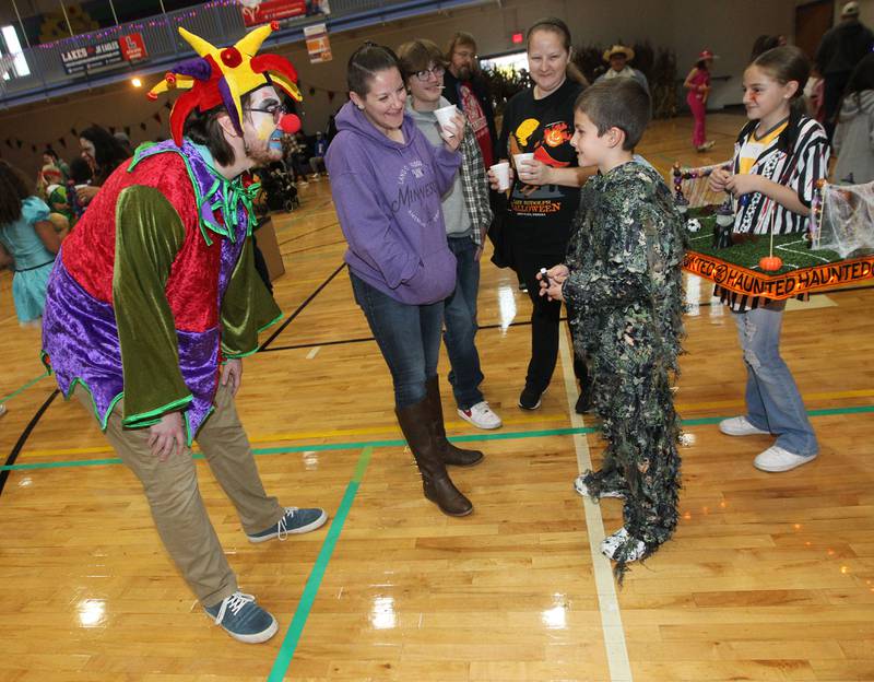 Matt Wrbanek, of Crystal Lake, dressed as a clown, visits with Michael Carey, 9, of Round Lake as his family stays close by during Witchy Thrills & Chills at the Lindenhurst Park District Lippert Community Center on October 14th in Lindenhurst.
Photo by Candace H. Johnson for Shaw Local News Network