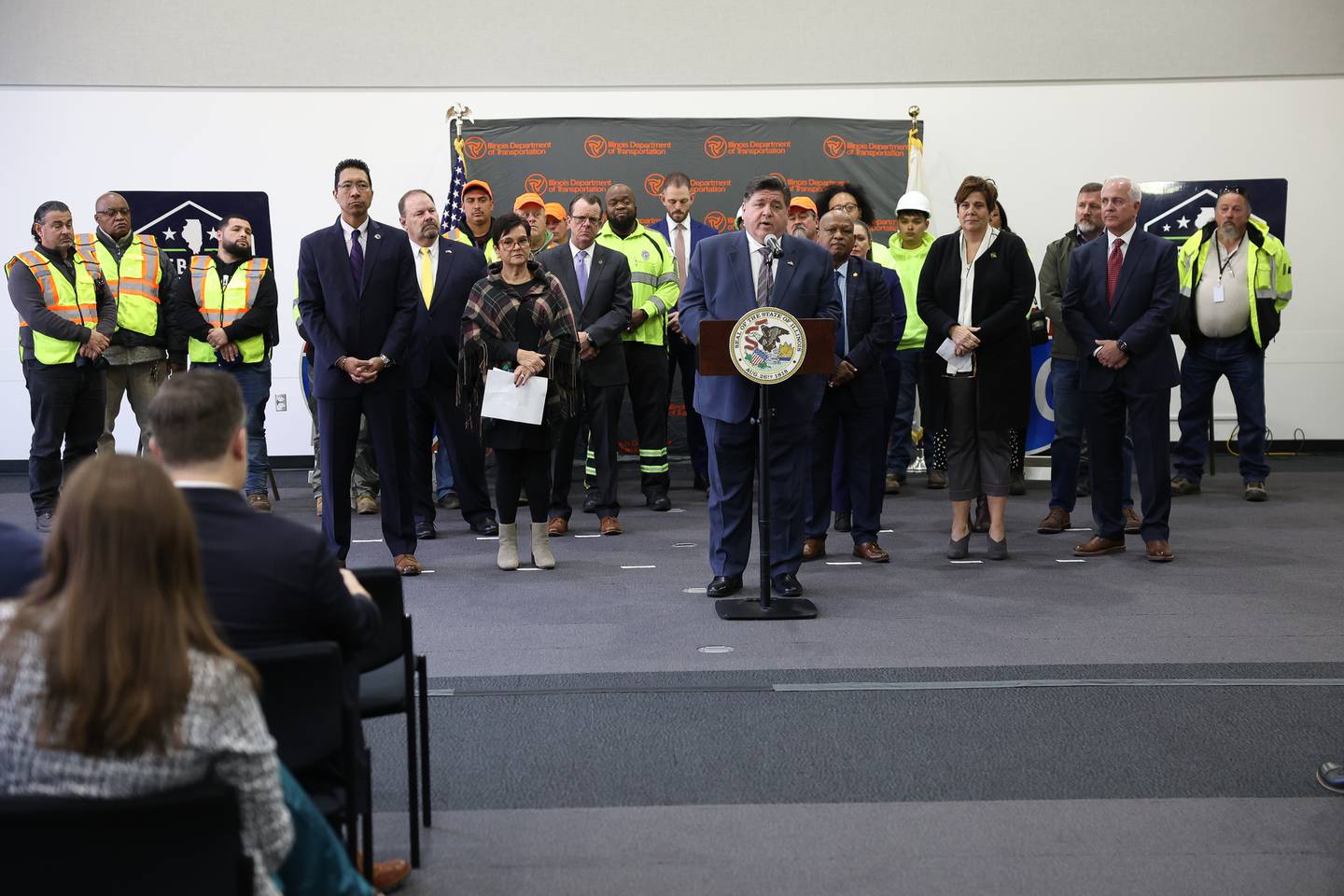 Governor JB Pritzker stands with members of the Illinois Department of Transportation along with local officials and community leaders at a press conference on reaching a key milestone for the  $1.3 Billion I-80 corridor project on Wednesday, Nov. 1, 2023 at Joliet Junior College.