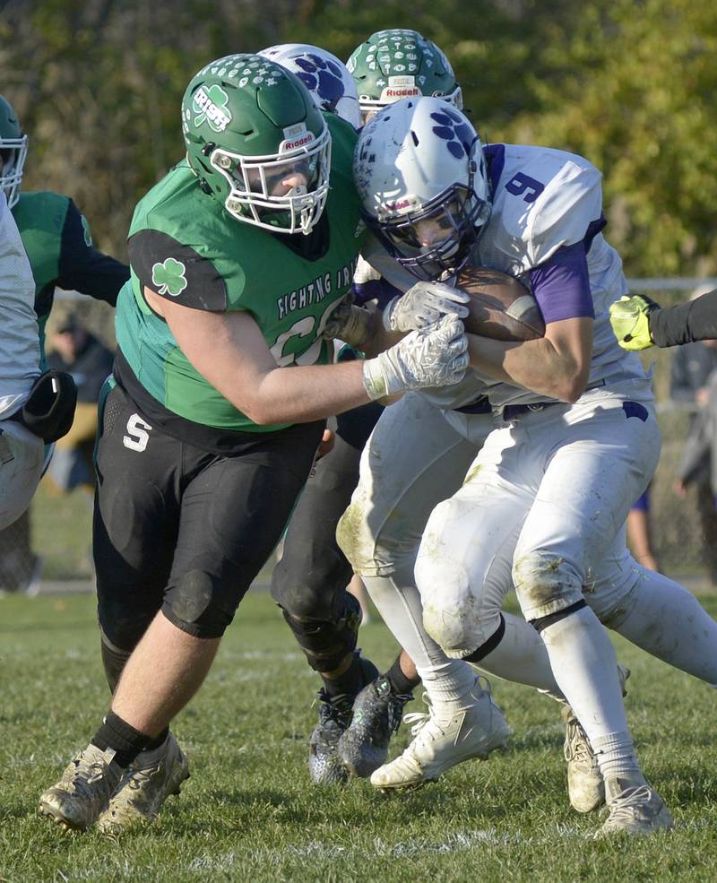 Seneca’s Casey Clennon puts a stop to the run by Wilmington’s Ryan Kettman in the 2nd quarter Saturday during the Class 2A Quarterfinal at Seneca.