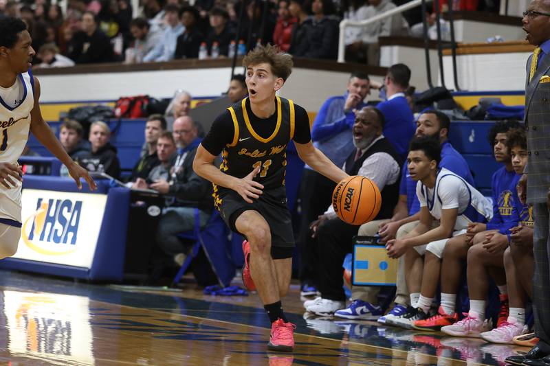 Joliet West’s Luke Grevengoed looks for a play against Joliet Central on Thursday, Jan. 15, 2026 in Joliet.