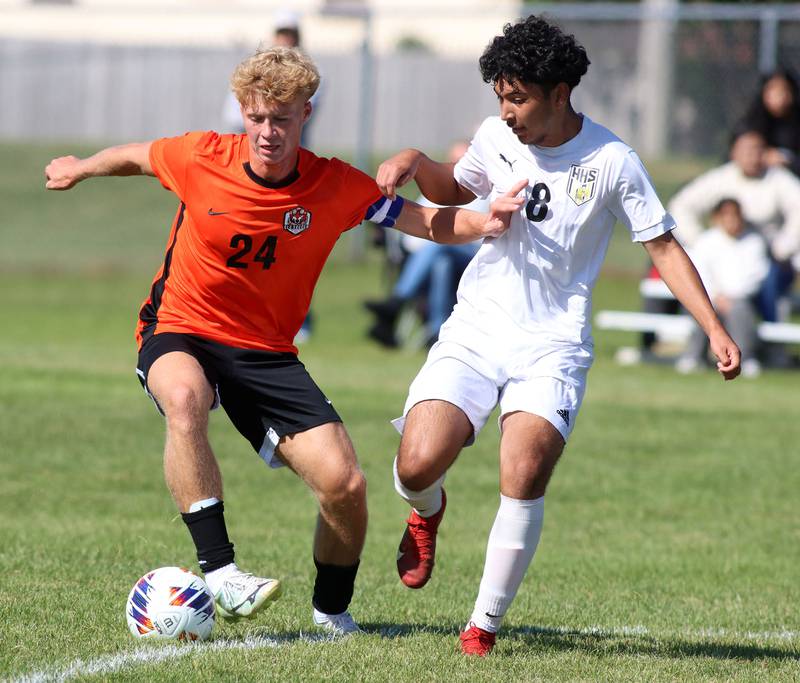 Crystal Lake Central’s Gavin Kane, left, battles Harvard’s Edgar Robles in varsity boys soccer at Crystal Lake Central High School in Crystal Lake on Saturday, Sept. 6, 2025.