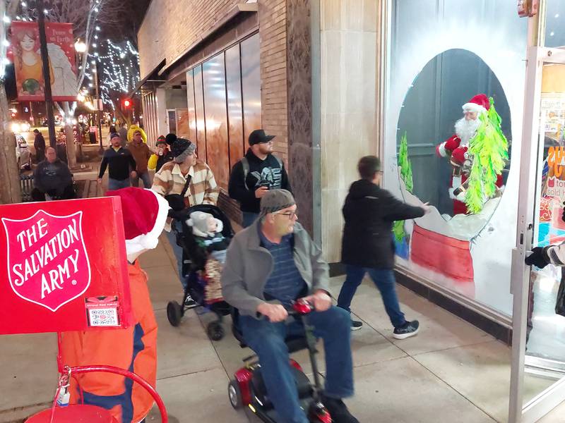 Shoppers make their way down La Salle Street past RPS Toys on Friday, Dec. 15, 2023, during the last weekend of the Chris Kringle Market in downtown Ottawa.