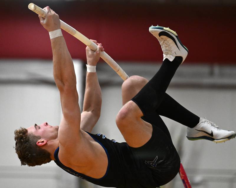 St. Charles North’s Nathan McLoughlin is about to clear the bar at 15-feet, six-inches while competing in pole vault during the DuKane Conference indoor track meet at Batavia High School on Friday, March 21, 2025.