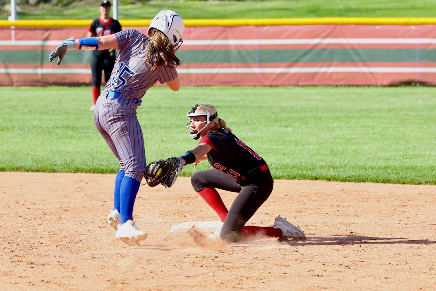 Hall short stop Charlie Pellegrini puts the tag on Princeton's Slyvie Rutledge in Thursday's game in Spring Valley. The Tigresses won 12-2 in six innings.