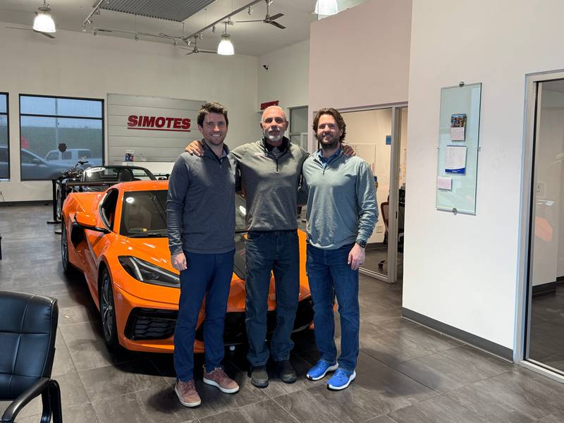 Larry Simotes (center) with his sons Mac (left) and Grant (right) at Simotes Motors on Friday, April 25, 2025.
