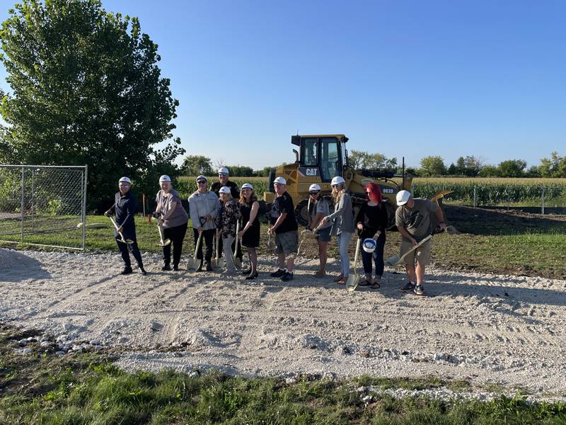 Village President Suzanne Fahnestock and Village Trustees Tonia Groezinger, JT Peloso, Hillary Joy, Cliff Speare and Jen Ward were present with hard hats and shovels to break ground in a ceremony marking the start of the construction of the village's second water tower. They were joined by members of the public, staff and Jeremy Lin from Lintech Engineering.