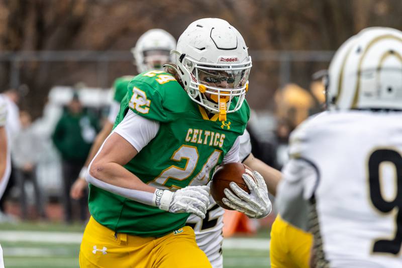 Providence's Broden Mackert picks-up yardage during a 5A varsity football semifinal game against Oak Forest at Providence Catholic High School on Nov. 22, 2025.
